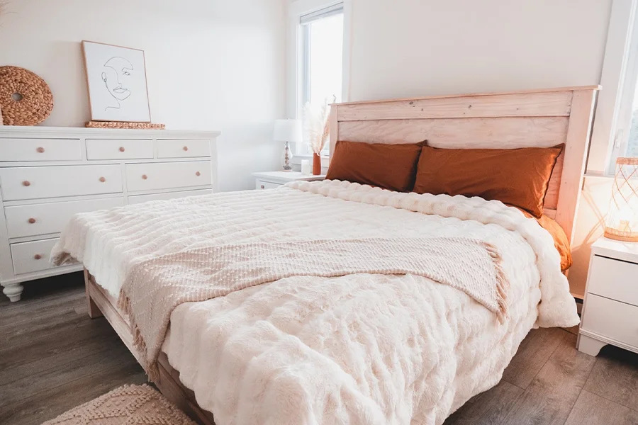 White Nordic style bed with natural light