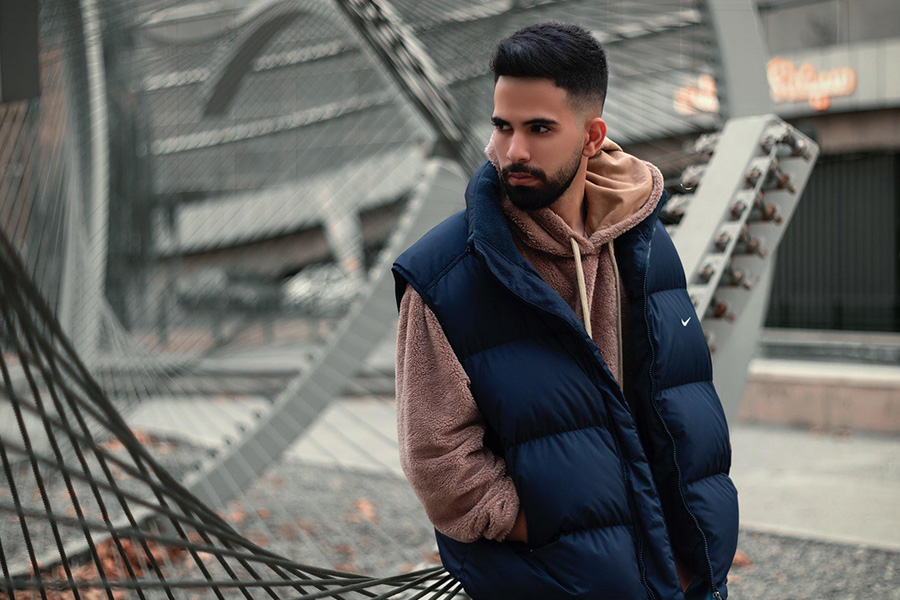 A man wearing a navy blue gilet