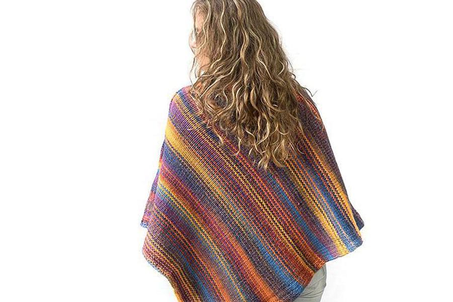 A woman in a multicolored poncho