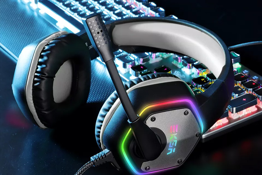 Black EKSA headset with rainbow lighting on top of keyboard