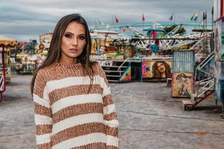 Lady wearing a striped crew neck