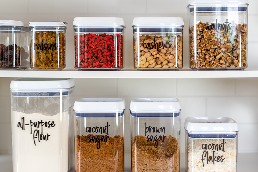 Neatly organized storage containers on a shelf