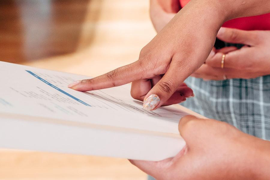 Anonymous people checking documents