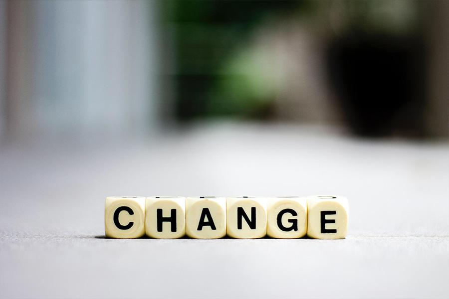 Dice with embossed lettering saying change