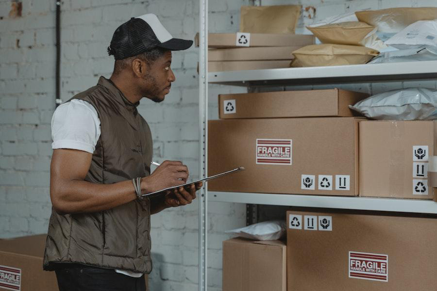 Man checking goods in storage