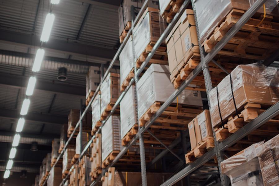 Warehouse showing rows of stacked pallets of goods