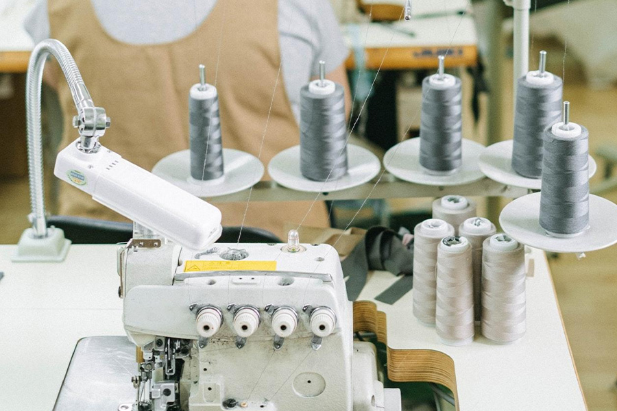 Cambio bobina automatico per macchine da cucire