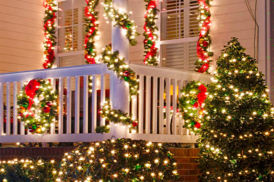 LED-lit garland outside a white house