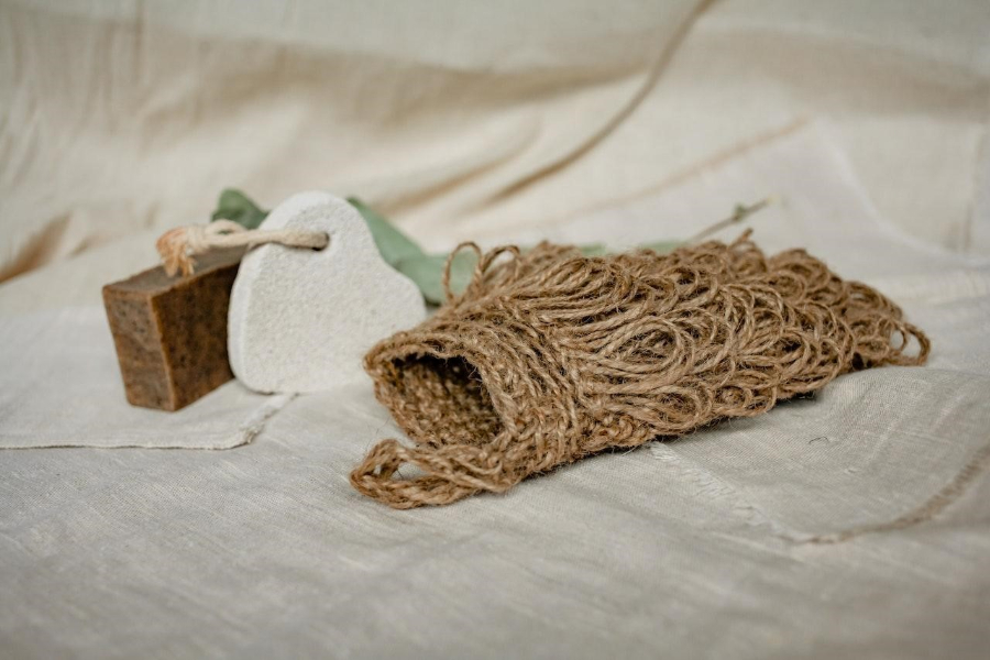 a brown knitted pouch lying on a surface