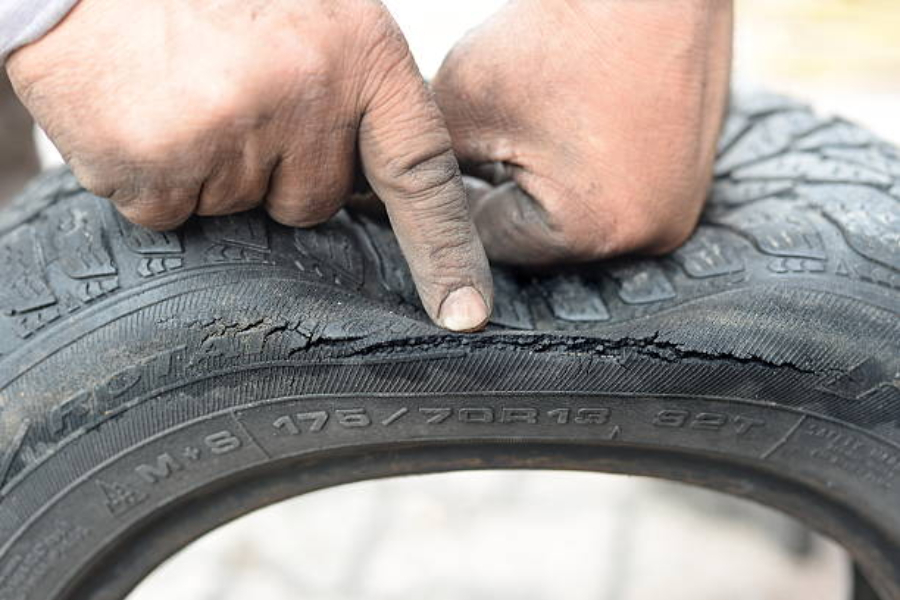 A side-view of a cracked tire