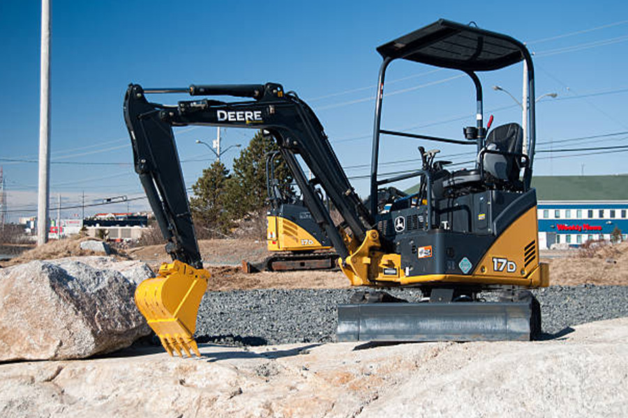 A small John Deere 17D Tractor on-site