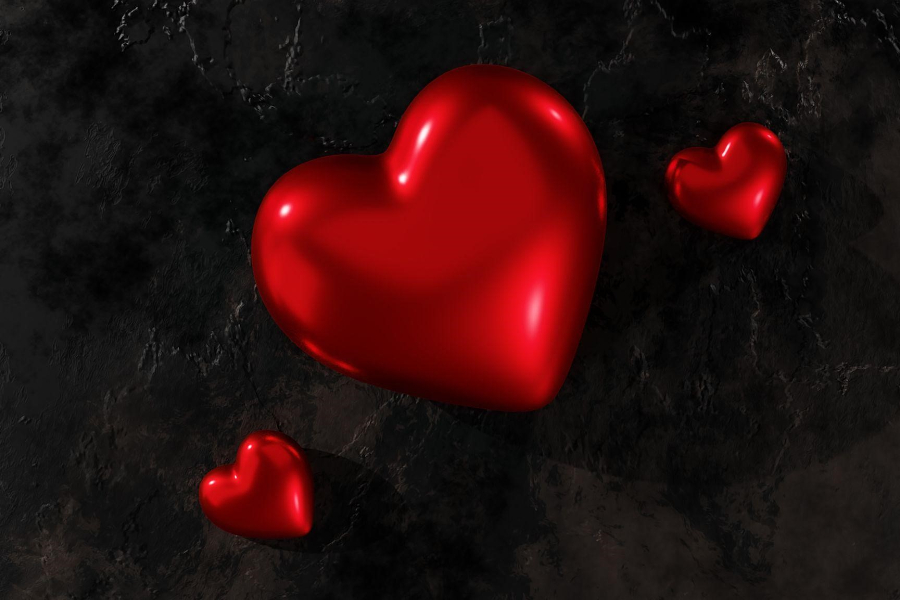 Heart-shaped packages on a black background